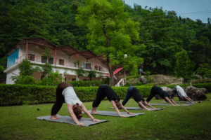 Students attending a 200 hour yoga teacher training class in Rishikesh India, the foundational certification for beginner and intermediate yoga practitioners